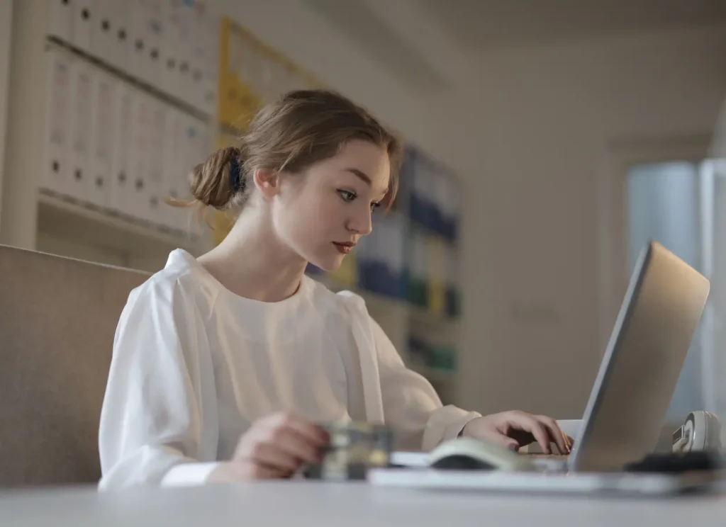 Small business owner reviewing bookkeeping records, illustrating Google Ads for accountants